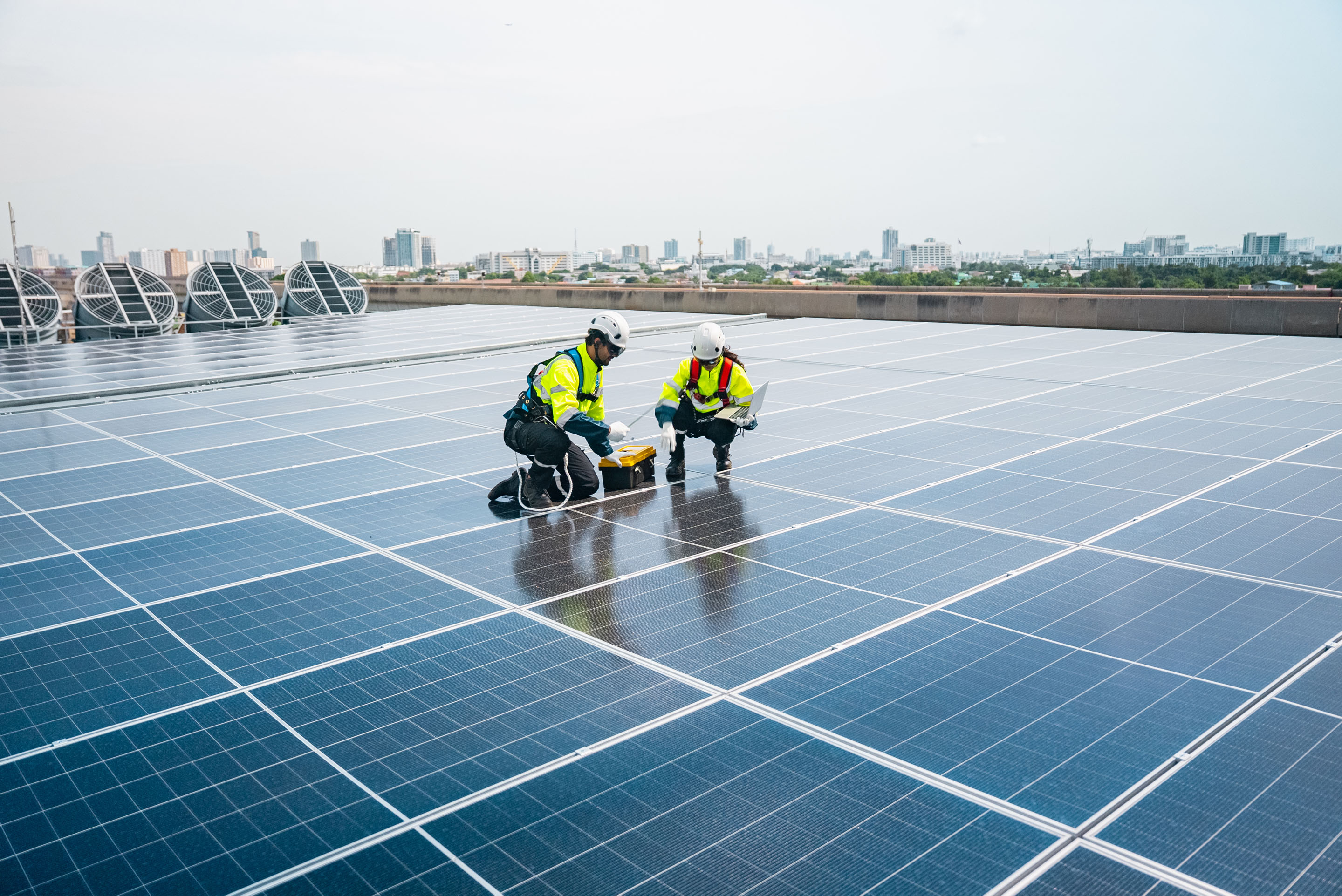 hon-engineers-inspecting-rooftop-solar-panels-city-2223811327.jpg