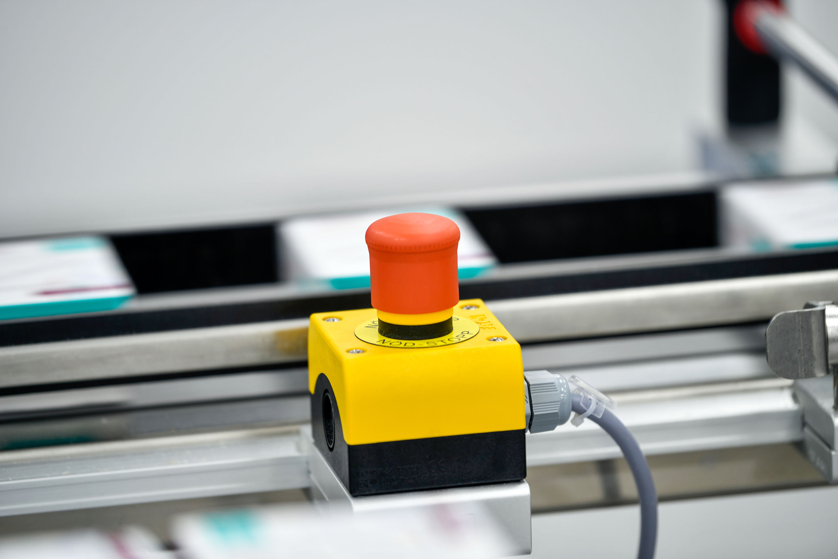 .hon-red-emergency-stop-button-factory-conveyor-machine-1164923977~imageoptim.jpg