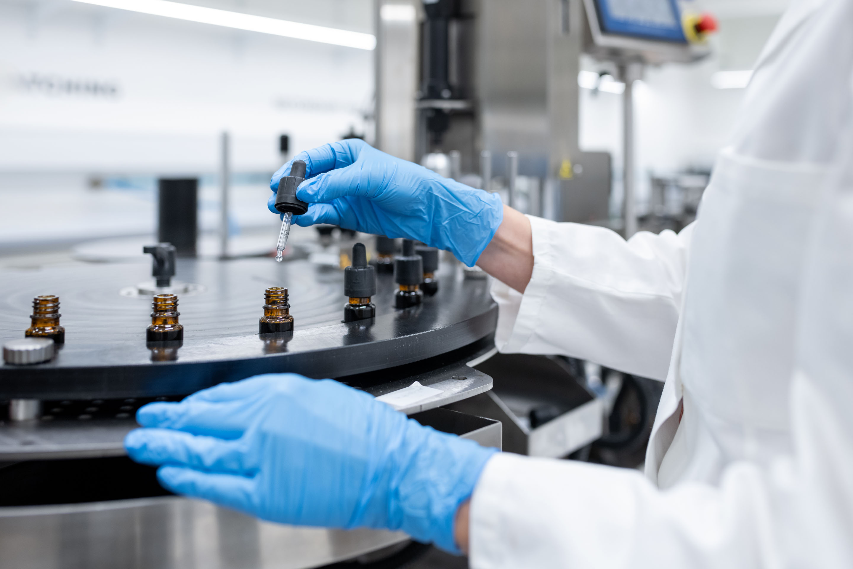 hon-lab-technician-pharmaceutical-vial-filling-2196965173.jpg