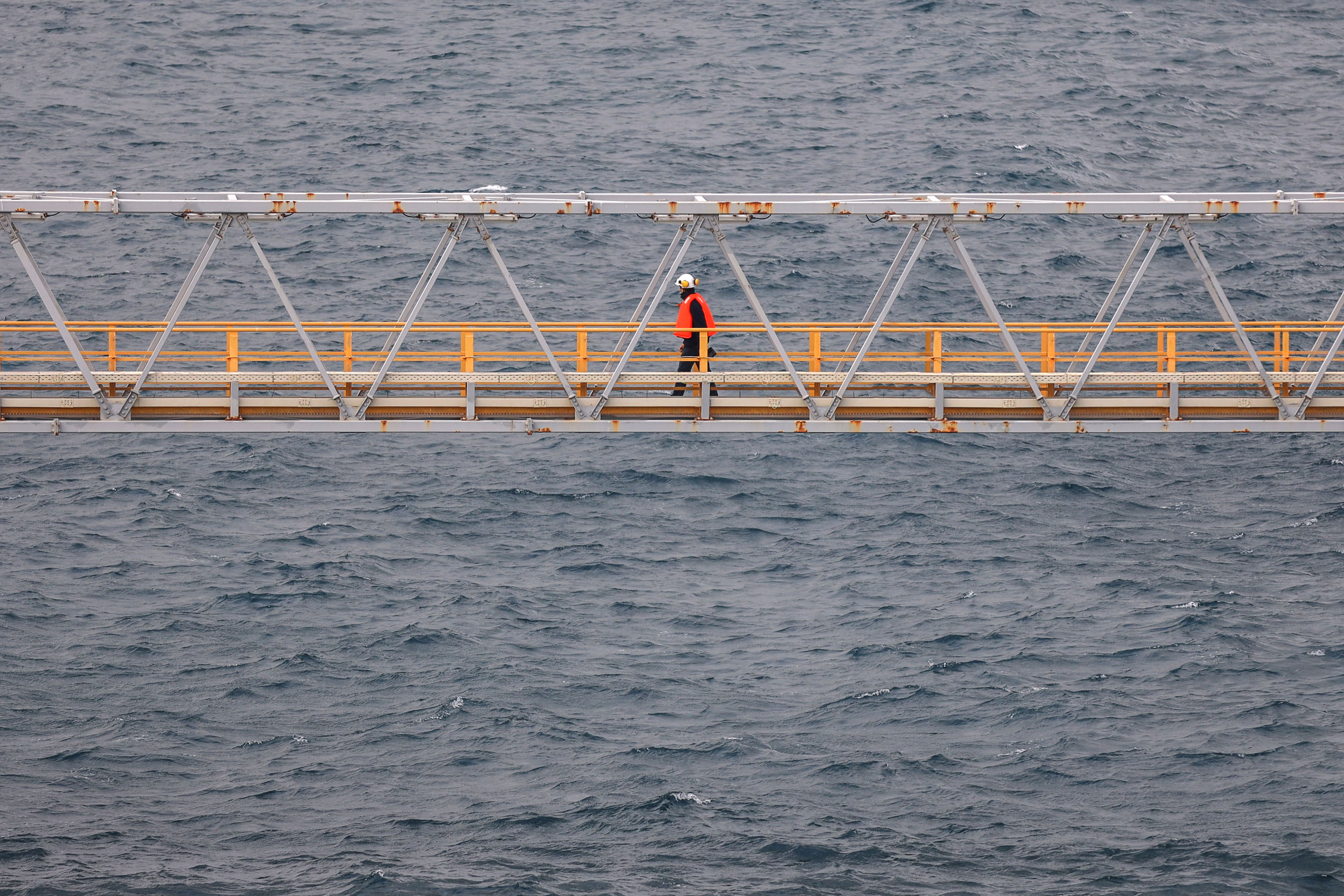 hon-engineer-walking-offshore-platform-gangway-1293288162.jpg